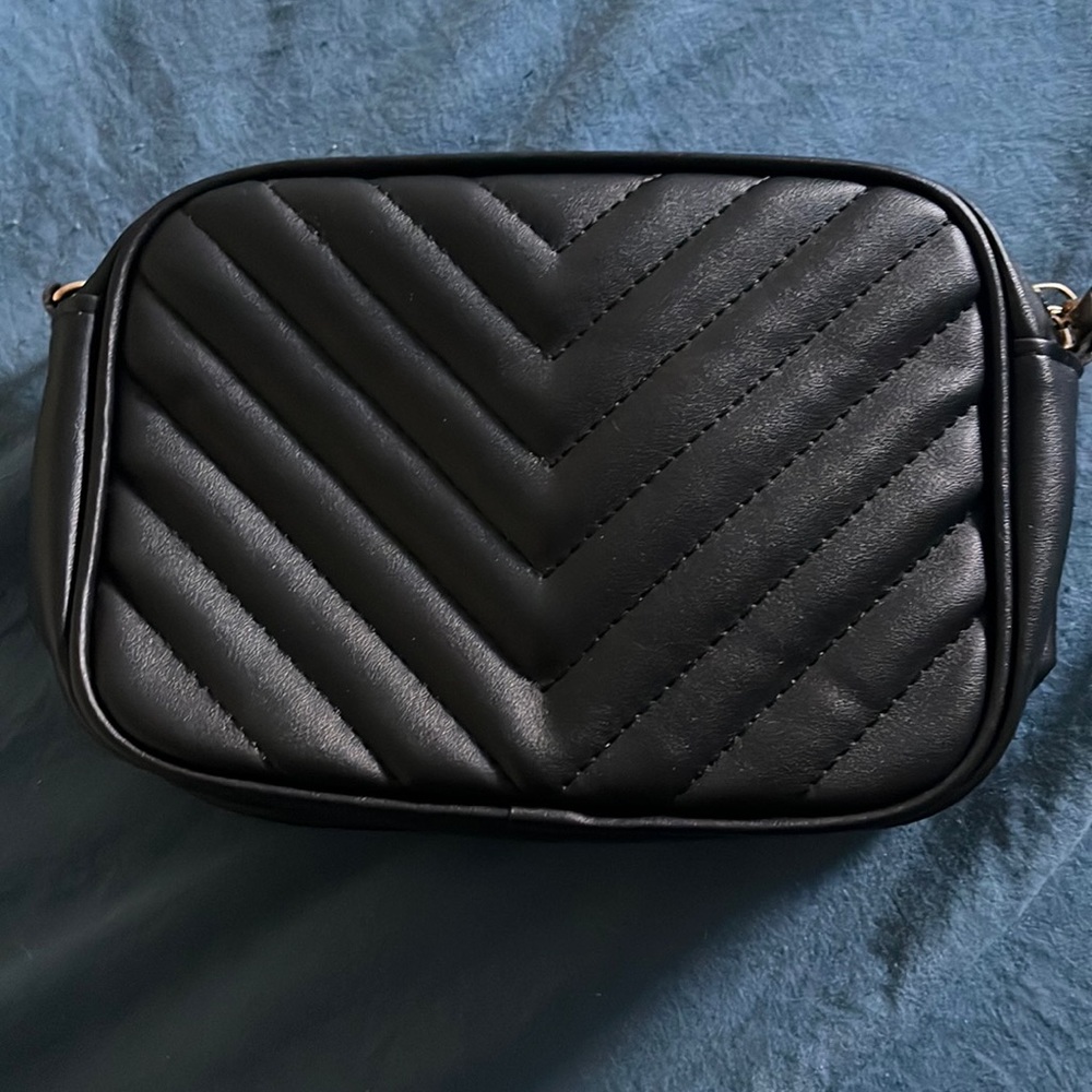 Black purse with gold chain